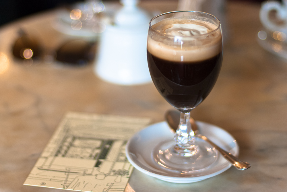 Bicerin coffee in a glass in a historic cafe in Turin Italy Bicerin coffee in a glass in a historic cafe in Turin Italy
