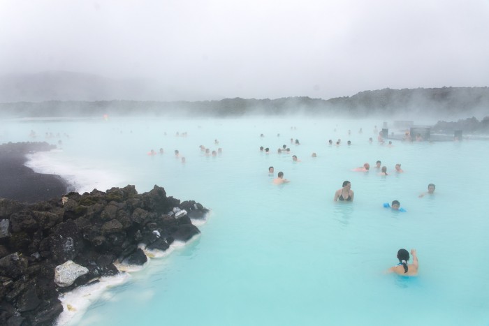 People swimming in the Blue Lagoon in Iceland People swimming in the Blue Lagoon in Iceland
