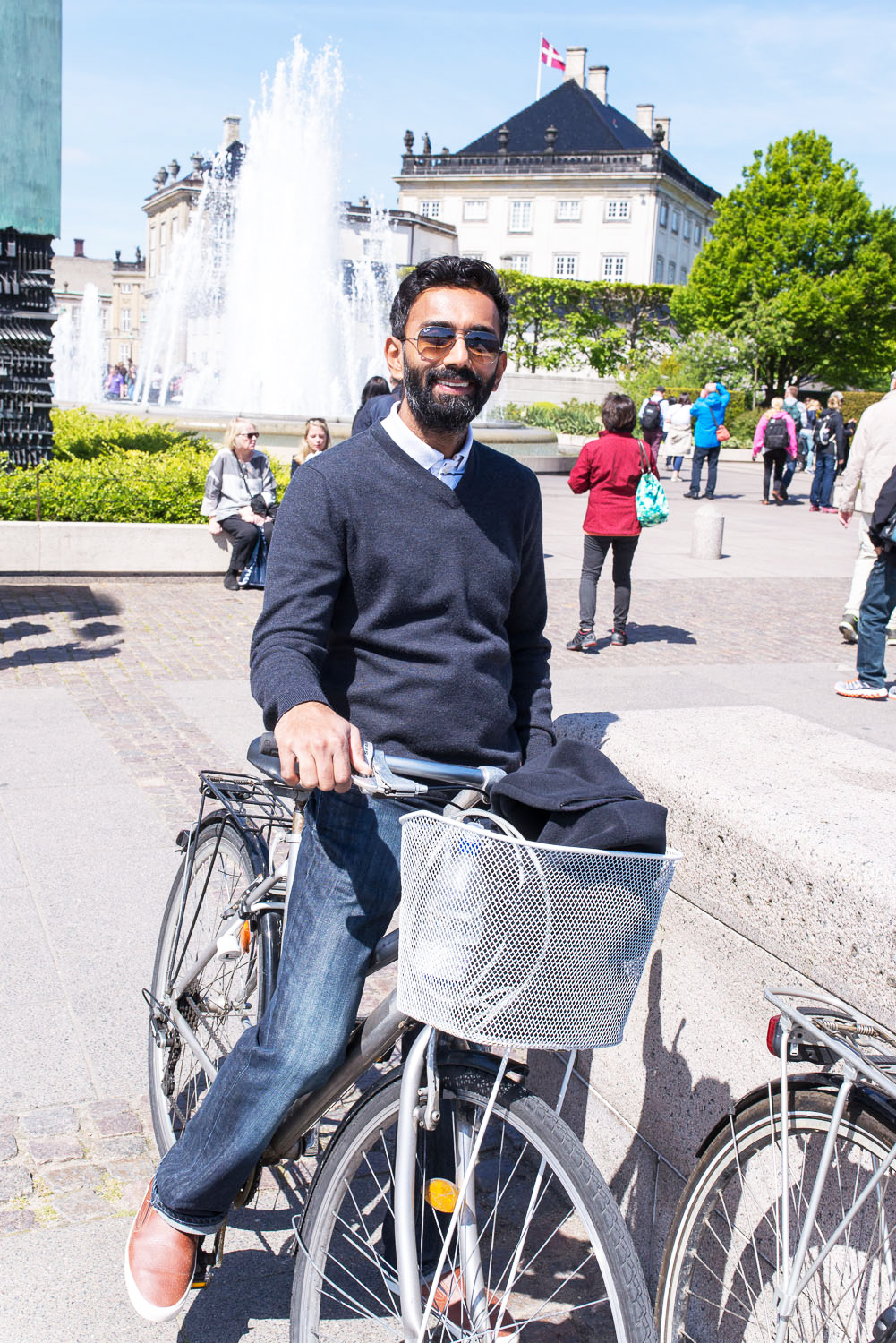 Young man on a city bicycle in Copenhagen city Young man on a city bicycle in Copenhagen city