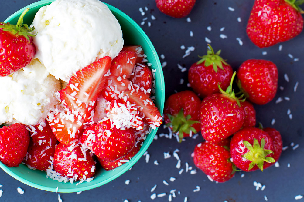 Coconut milk ice cream with fresh strawberries