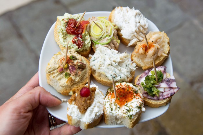 a plate of cicchetti food for aperitivo in Venice Italy a plate of cicchetti food for aperitivo in Venice Italy