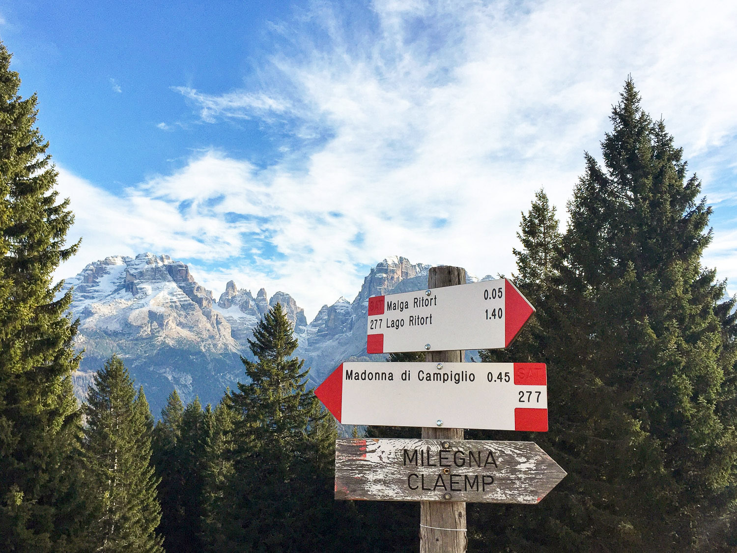 Hiking signs in the Dolomites mountains, Italian Alps, near Madonna di Campiglio