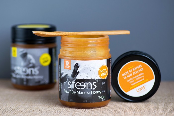jars of manuka honey on a table jars of manuka honey on a table