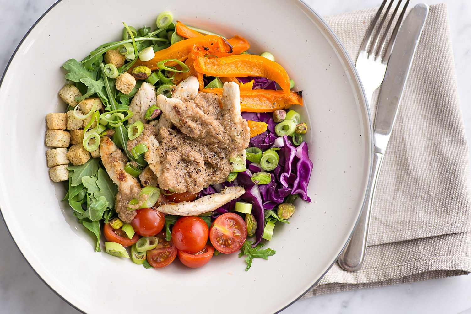 Chicken rainbow salad with Grana Padano cheese based vinaigrette