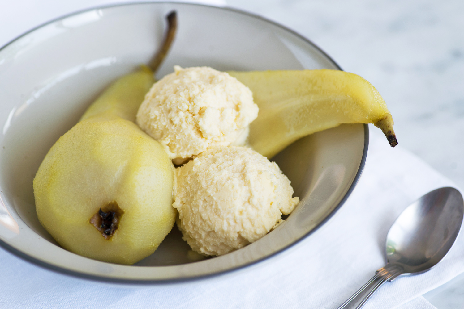 Poached pears with Grana Padano cheese ice cream