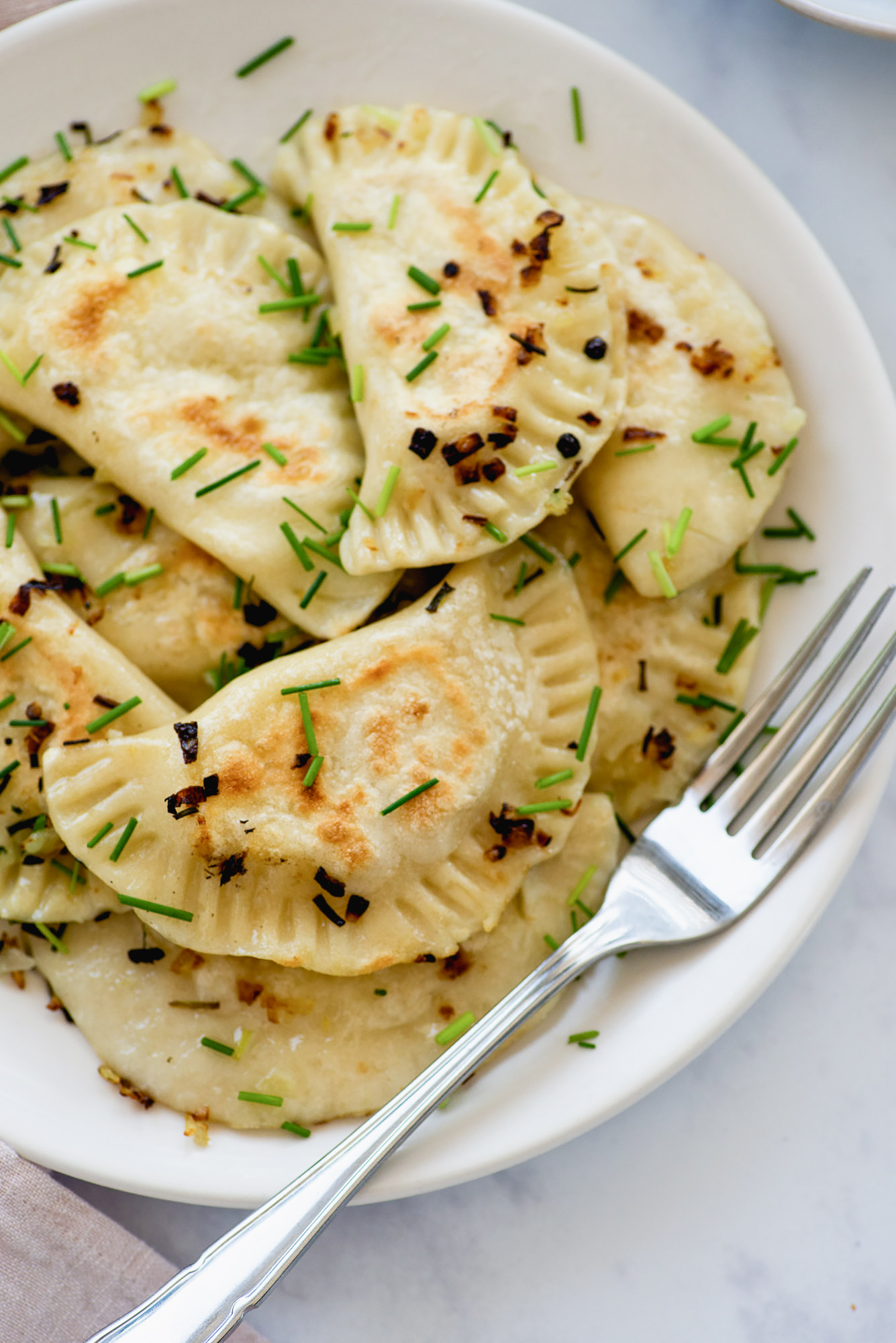 Pierogi Ruskie: vegetarian Polish dumplings with potatoes & cheese | Recipe from Wild Honey and Rye cookbook by Ren Behan | #mondomulia