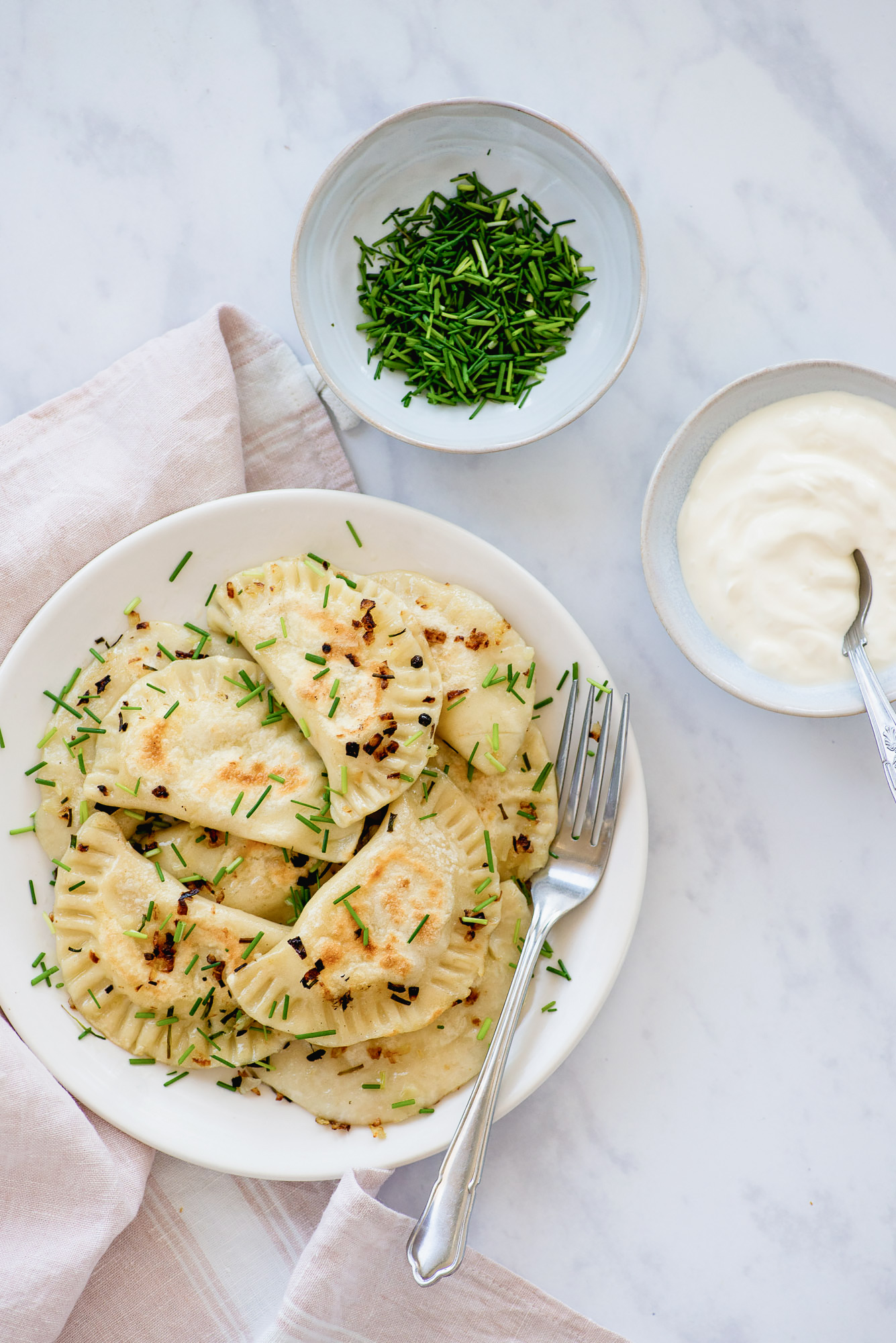 Pierogi Ruskie: vegetarian Polish dumplings with potatoes & cheese | Recipe from Wild Honey and Rye cookbook by Ren Behan | #mondomulia