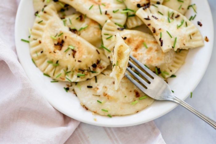 Pierogi Ruskie: vegetarian Polish dumplings with potatoes & cheese | Recipe from Wild Honey and Rye cookbook by Ren Behan | #mondomulia