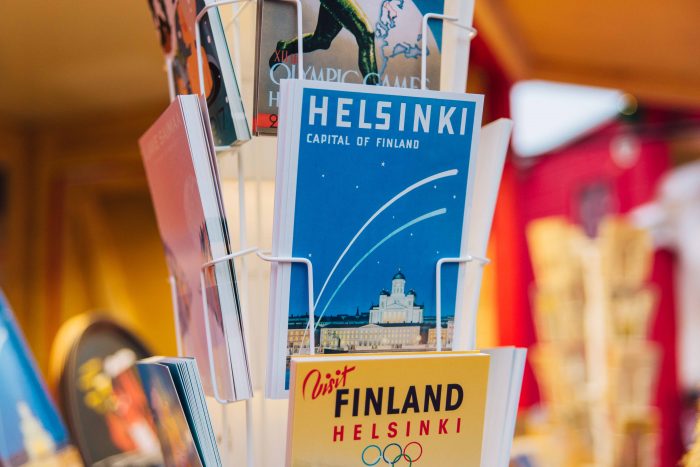 Postcards depicting traditional "travel posters of Finland" at Manta's Christmas Market in Havis Amanda Square