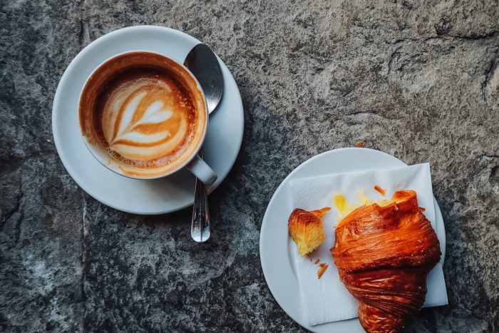 Cappuccino and cornetto for breakfast at SimBIOsi coffee shop in Florence