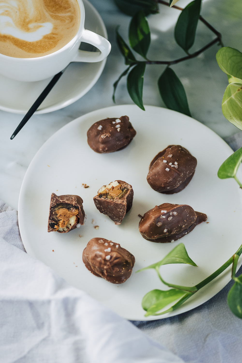 Chocolate covered Dates stuffed with Speculoos cookie spread and Pecans