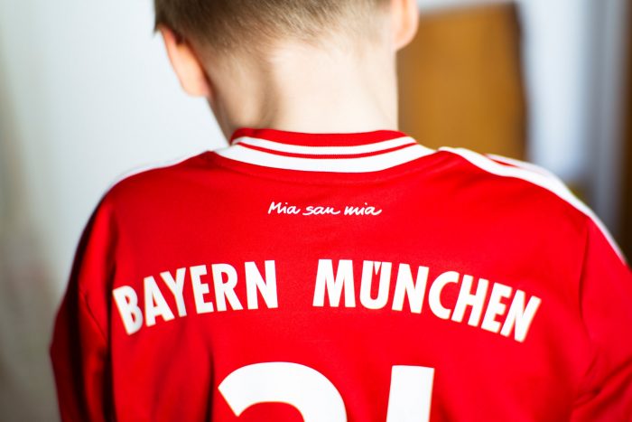 Boy wearing Bayern Munchen football shirt