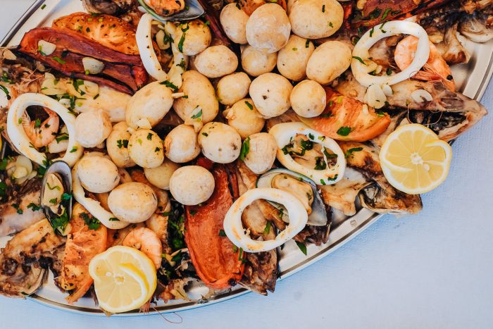 Seafood platter with Papas arrugadas, a traditional boiled potato dish of the Canary Islands.
