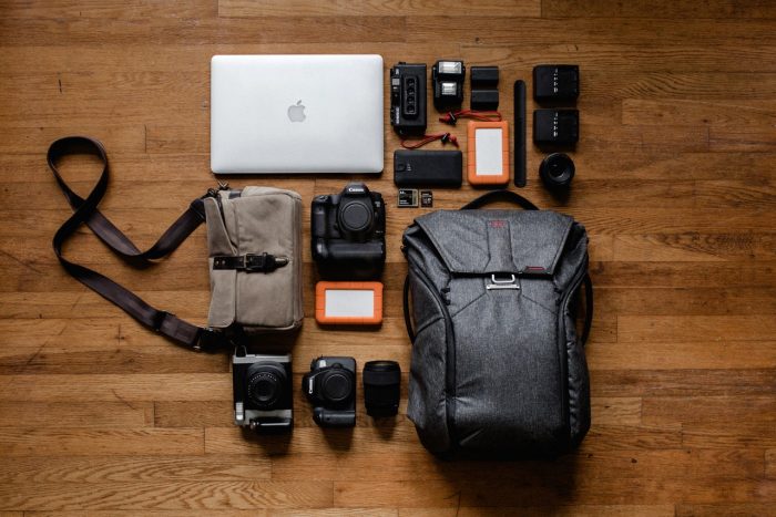 Black backpack travel camera equipment and laptop