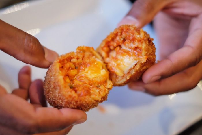 Roman fried risotto balls: suppli with tomato sauce and mozzarella Roman fried risotto balls: suppli with tomato sauce and mozzarella
