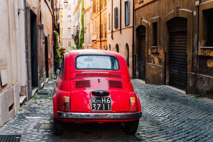 Fiat 500 red car in Monti neighbourhood, Rome, Italy