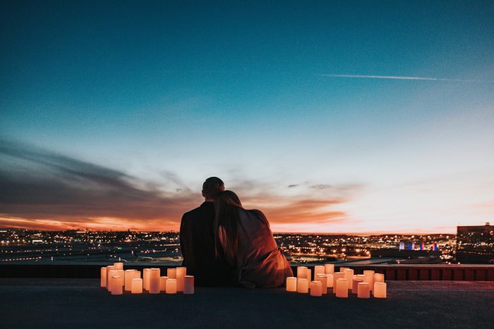 Couple watching the sunset in Los Angeles, California 