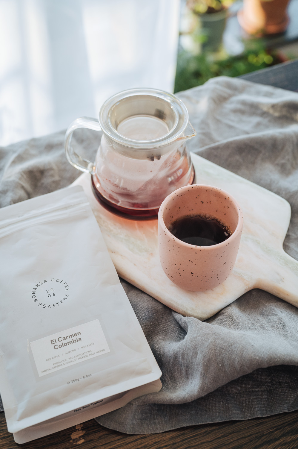 Filter coffee in a cup and a coffee bag on a table