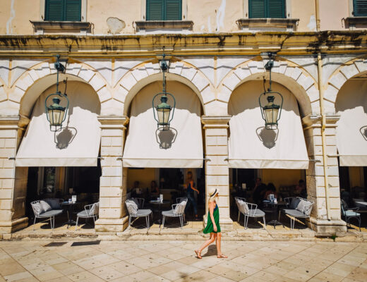 young girl walking in the Old town of Corfu in Greece