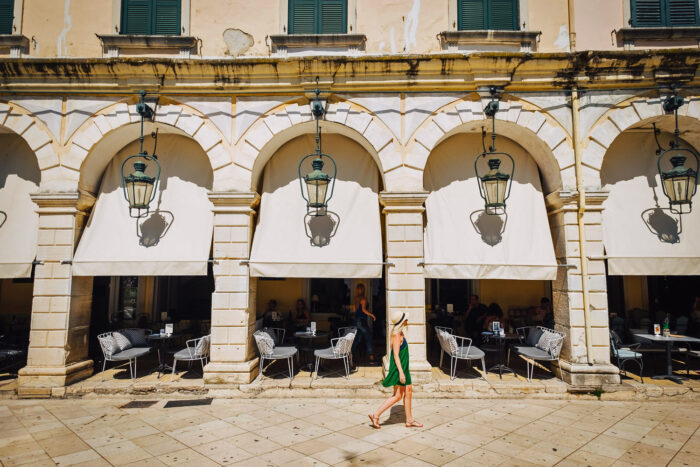 young girl walking in the Old town of Corfu in Greece young girl walking in the Old town of Corfu in Greece