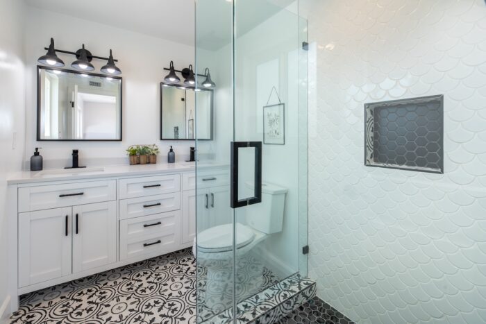 photo of a bathroom with white cabinets