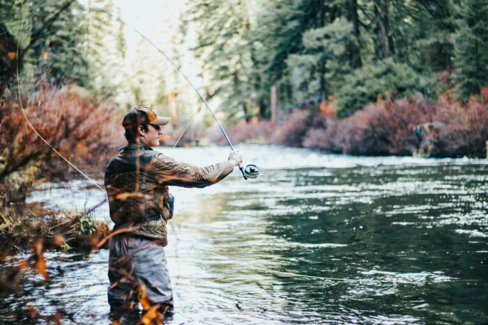 man fishing during daytime man fishing during daytime