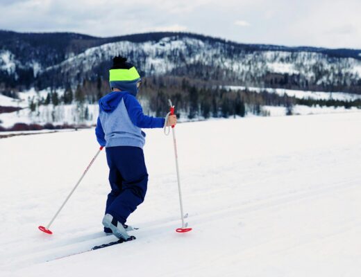 A child doing cross-country ski in the snow