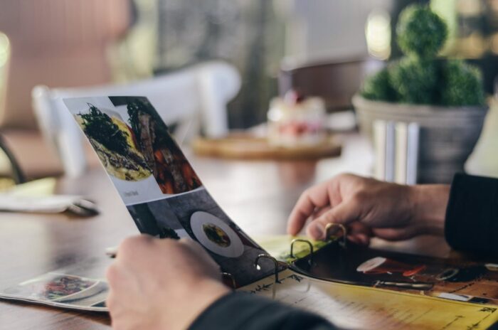 person holding a menu in a restaurant