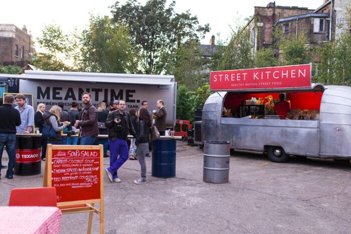 Street food trucks and bars at a food market in East London