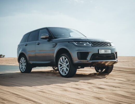 car parked on sand in the desert in Dubai, United Arab Emirates