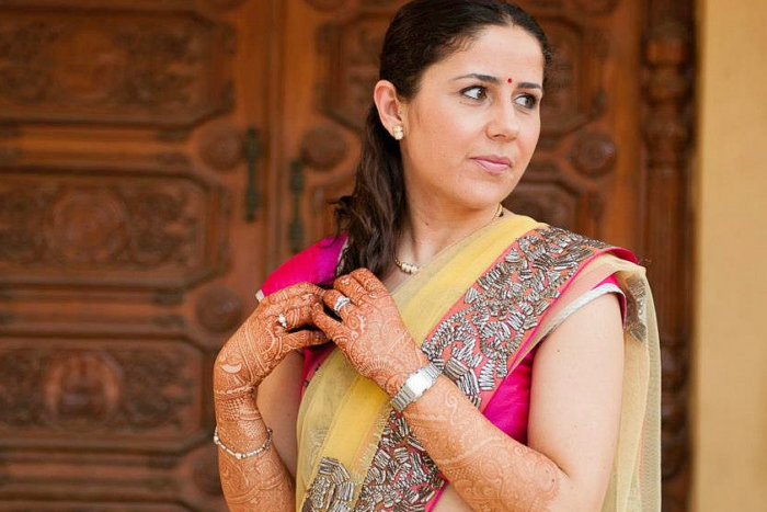 Woman wearing a sari at a Mehendi wedding ceremony in India