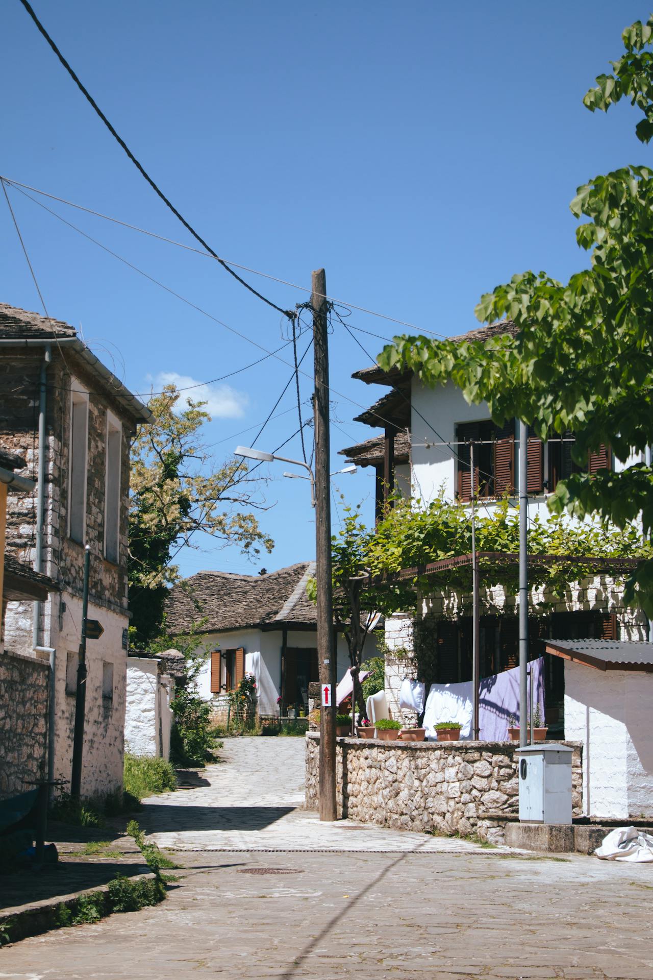 View of an Alley between Houses in a Town View of an Alley between Houses in a Town in Greece