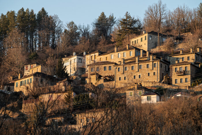 Stone houses of traditional architecture in Kipoi, in Zagori of Epirus, Greece at sunset Stone houses of traditional architecture in Kipoi, in Zagori of Epirus, Greece at sunset