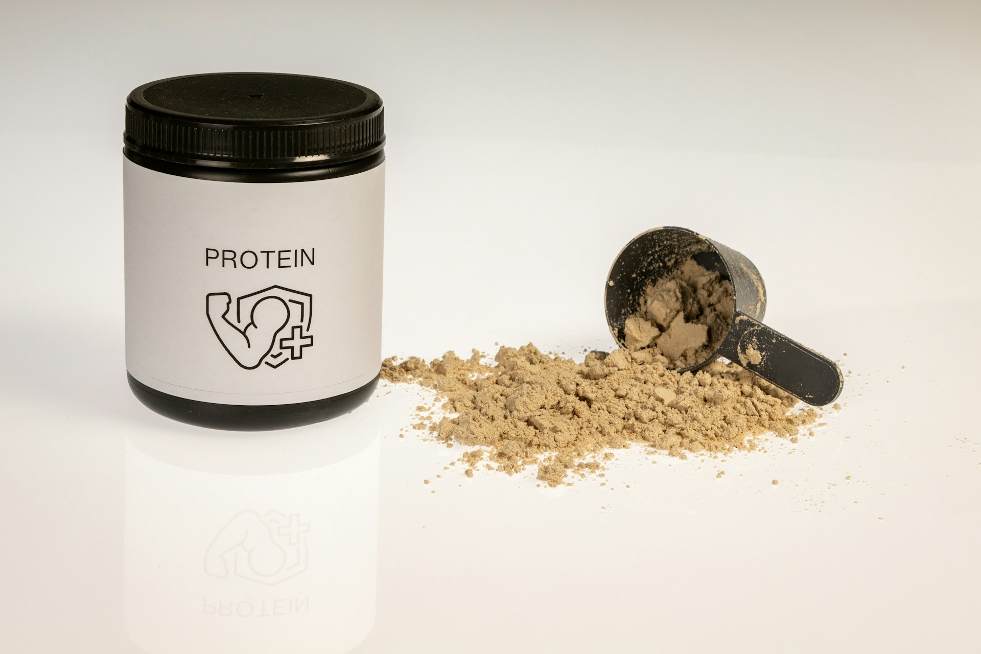 a jar of protein powder on a white table