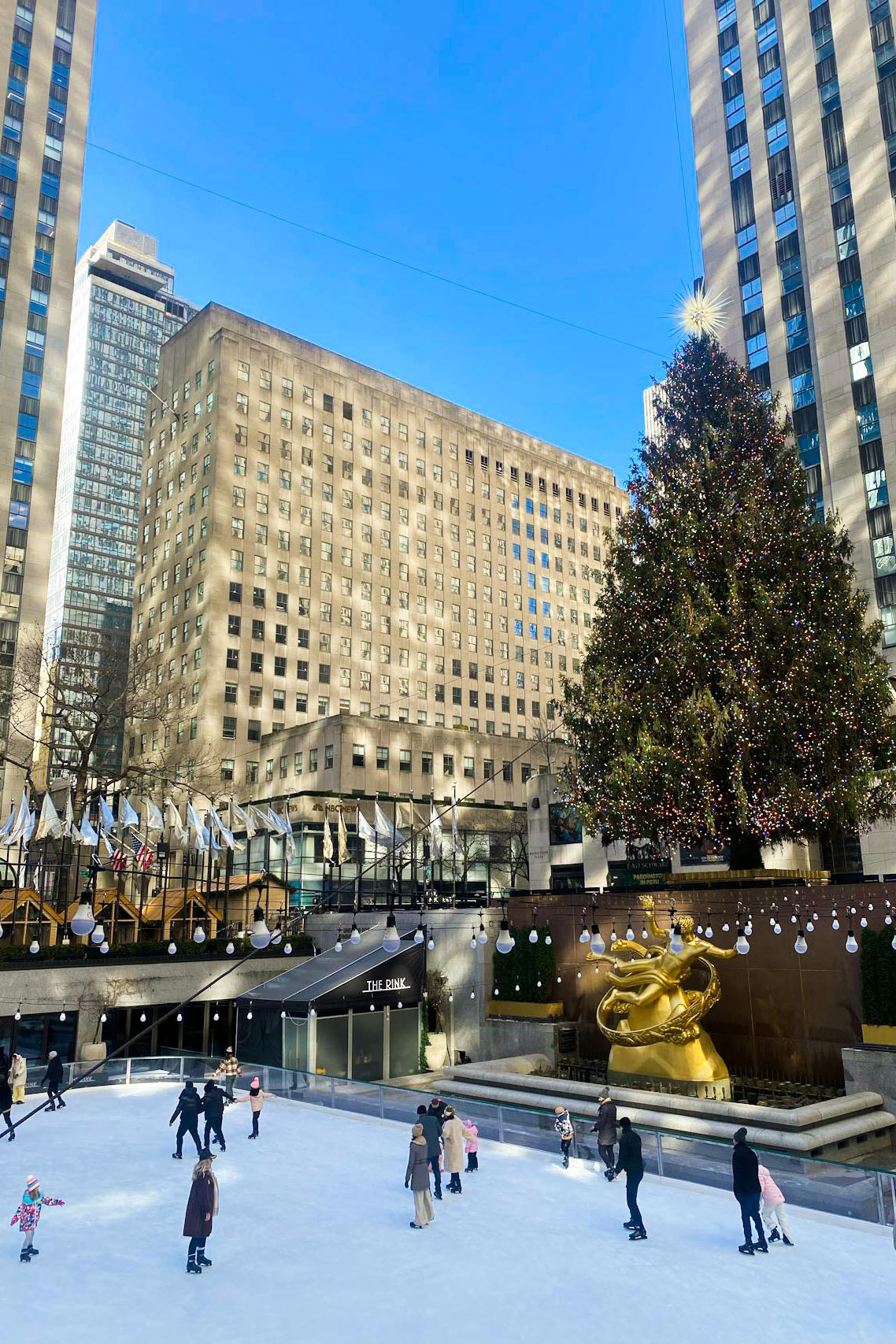 winter ice skating at Rockefeller Center in New York City winter ice skating at Rockefeller Center in New York City