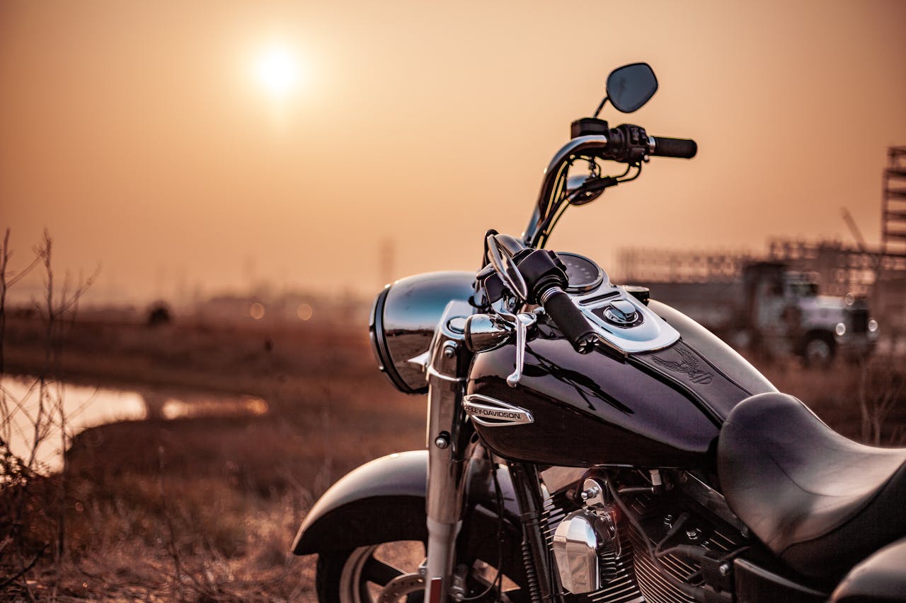 black cruiser motorcycle at sunset