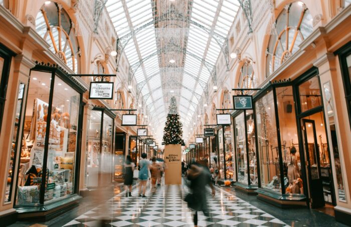 person walking inside shopping arcade in Christmas time in Melbourne