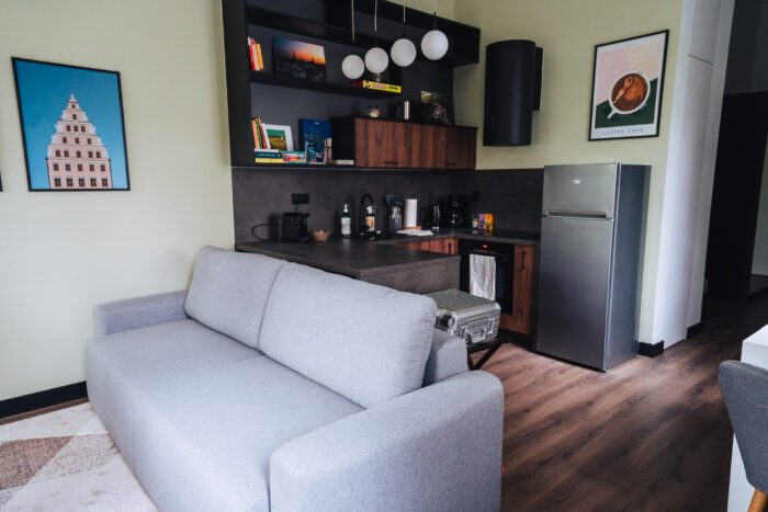 Sofa and kitchen in a vacation home for rent