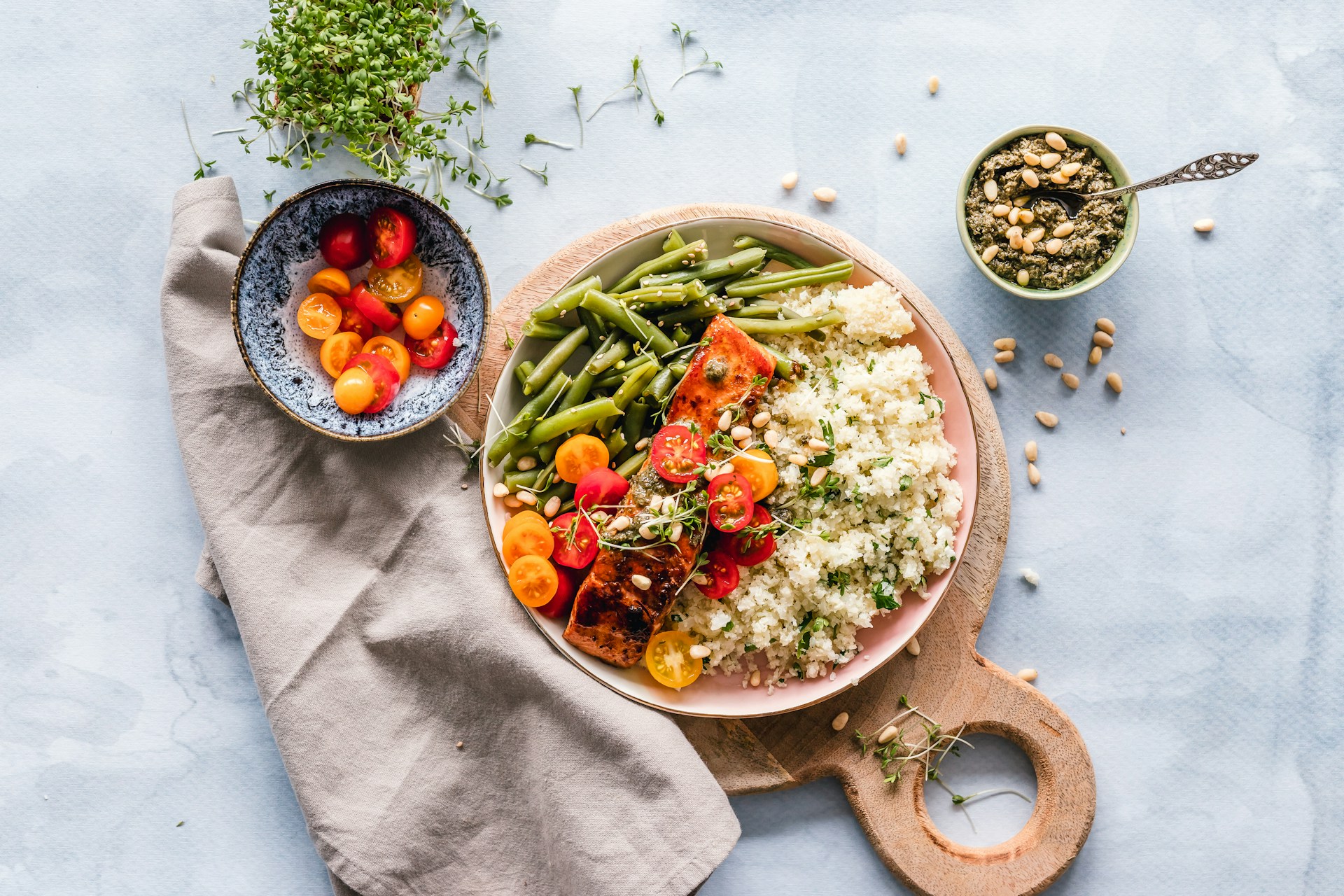 salmon vegetables couscous salad on a white table photo