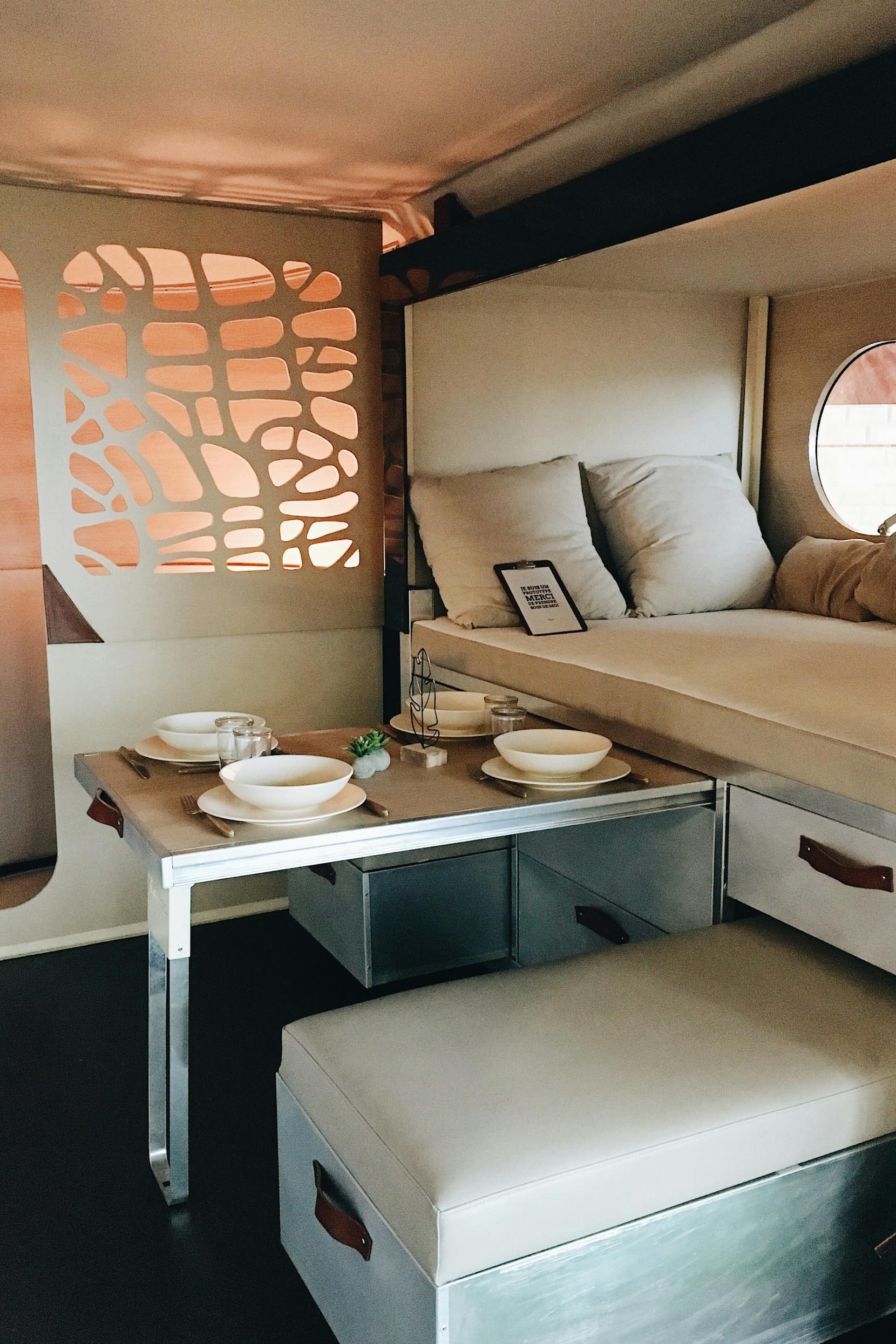 white wooden storage bed inside a campervan motorhome photo