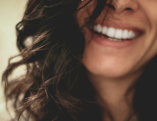 brown long hair woman smiling close-up photography