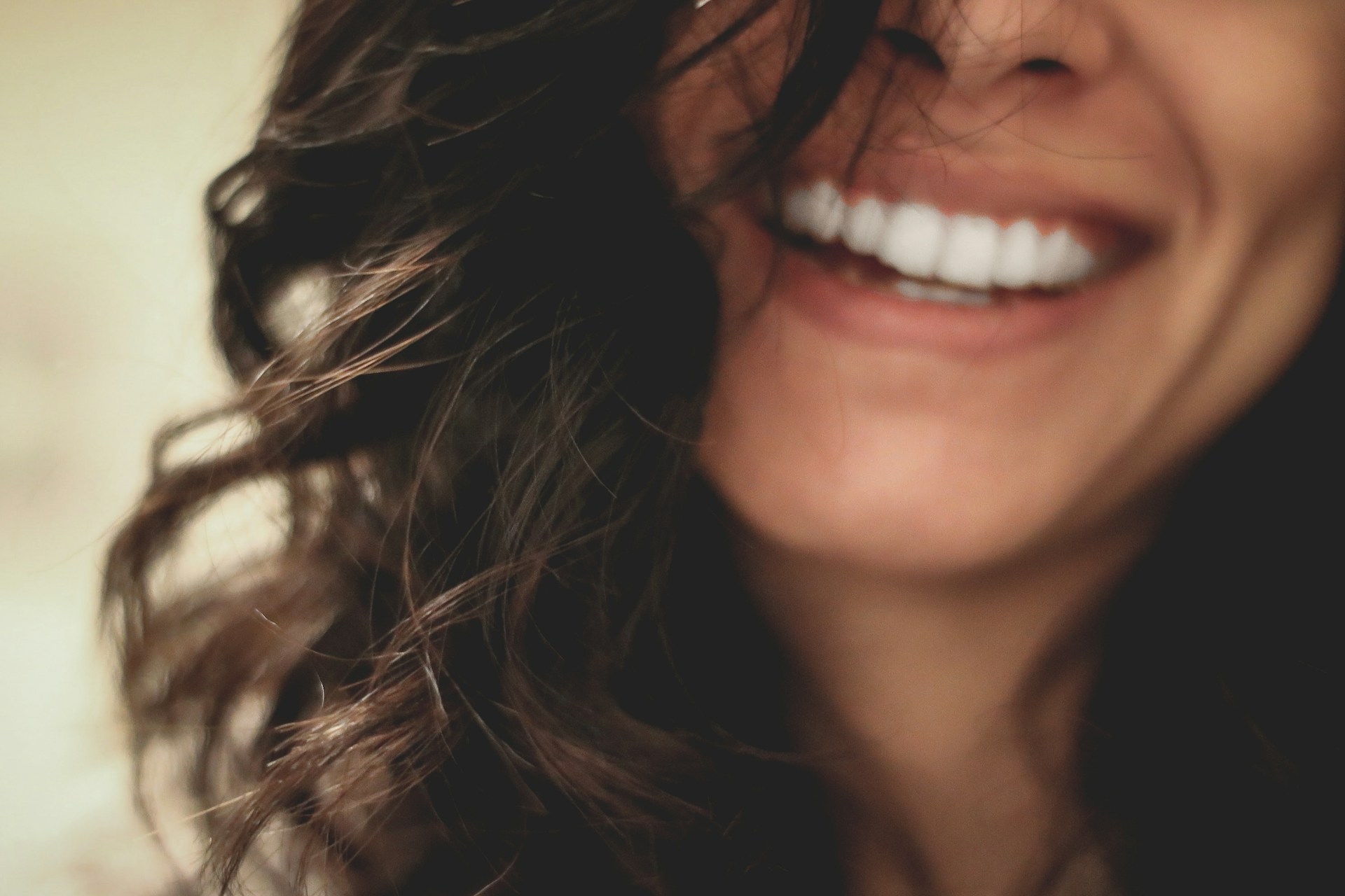 brown long hair woman smiling close-up photography