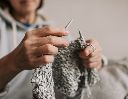a woman knitting wool