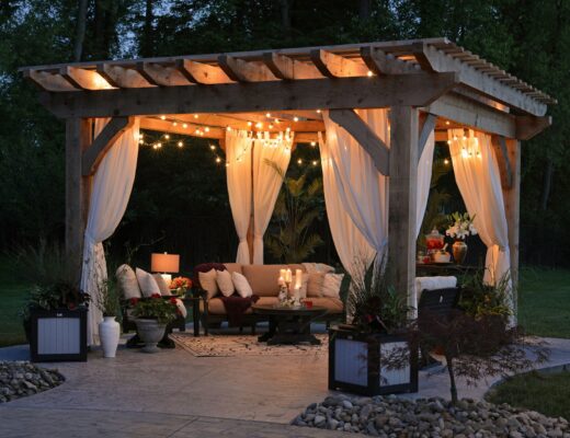 photo of gazebo with outdoor furniture and string lights at night