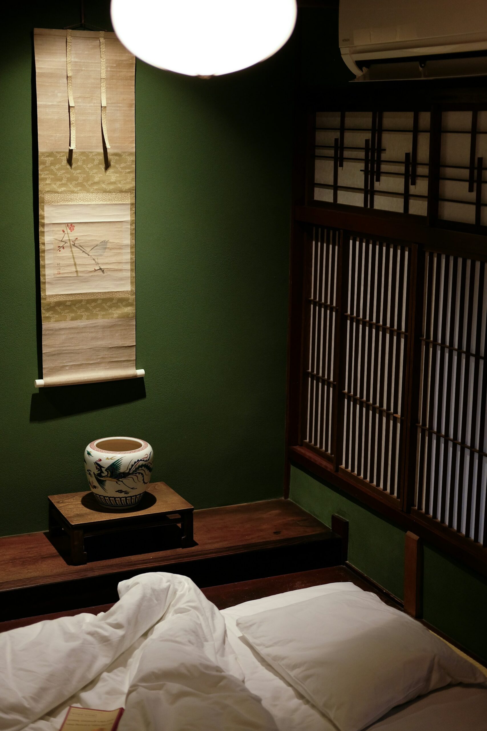 a traditional japanese bedroom with tatami mat and shoji screens