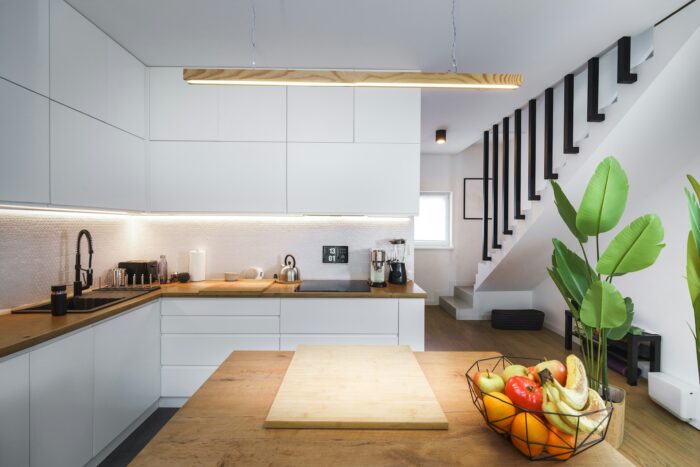 a modern kitchen with white furniture a modern kitchen with white furniture