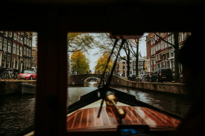 boat ride on canal in Amsterdam and buildings