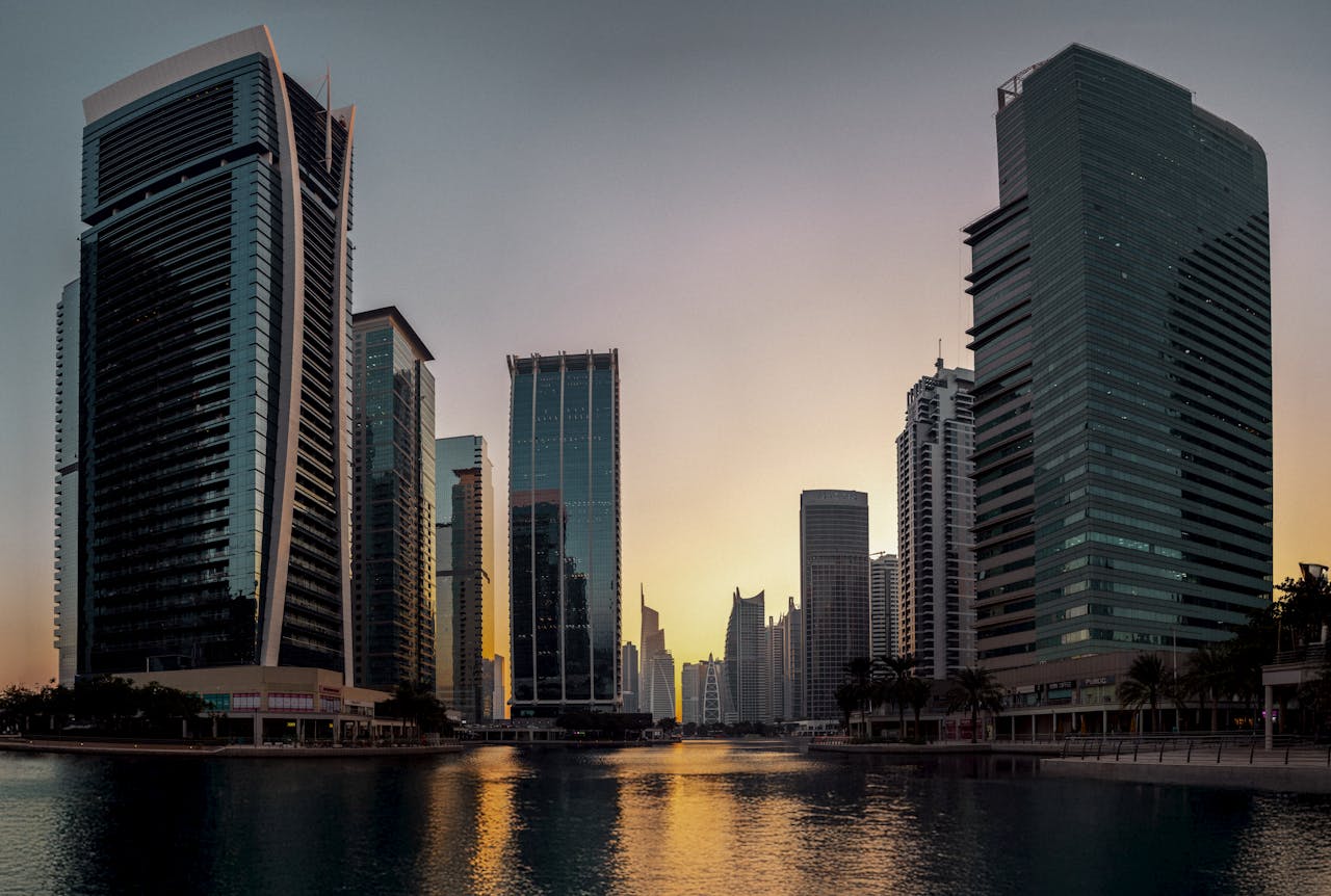 modern skyline of Dubai at sunset reflection modern skyline of Dubai at sunset reflection