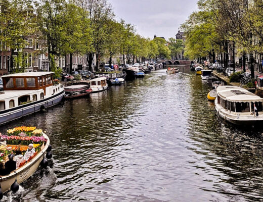 boats on the canal and buildings in Amsterdam