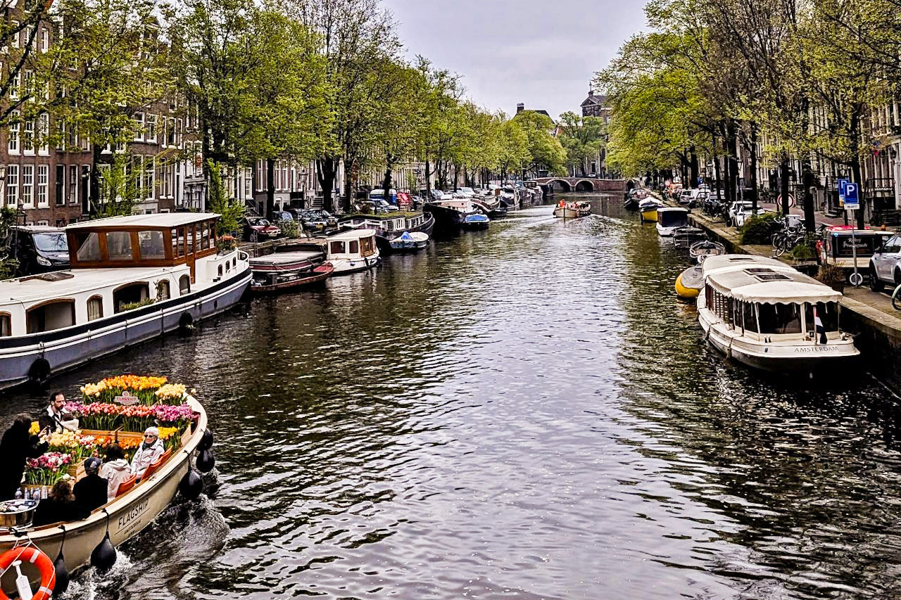 boats on the canal and buildings in Amsterdam